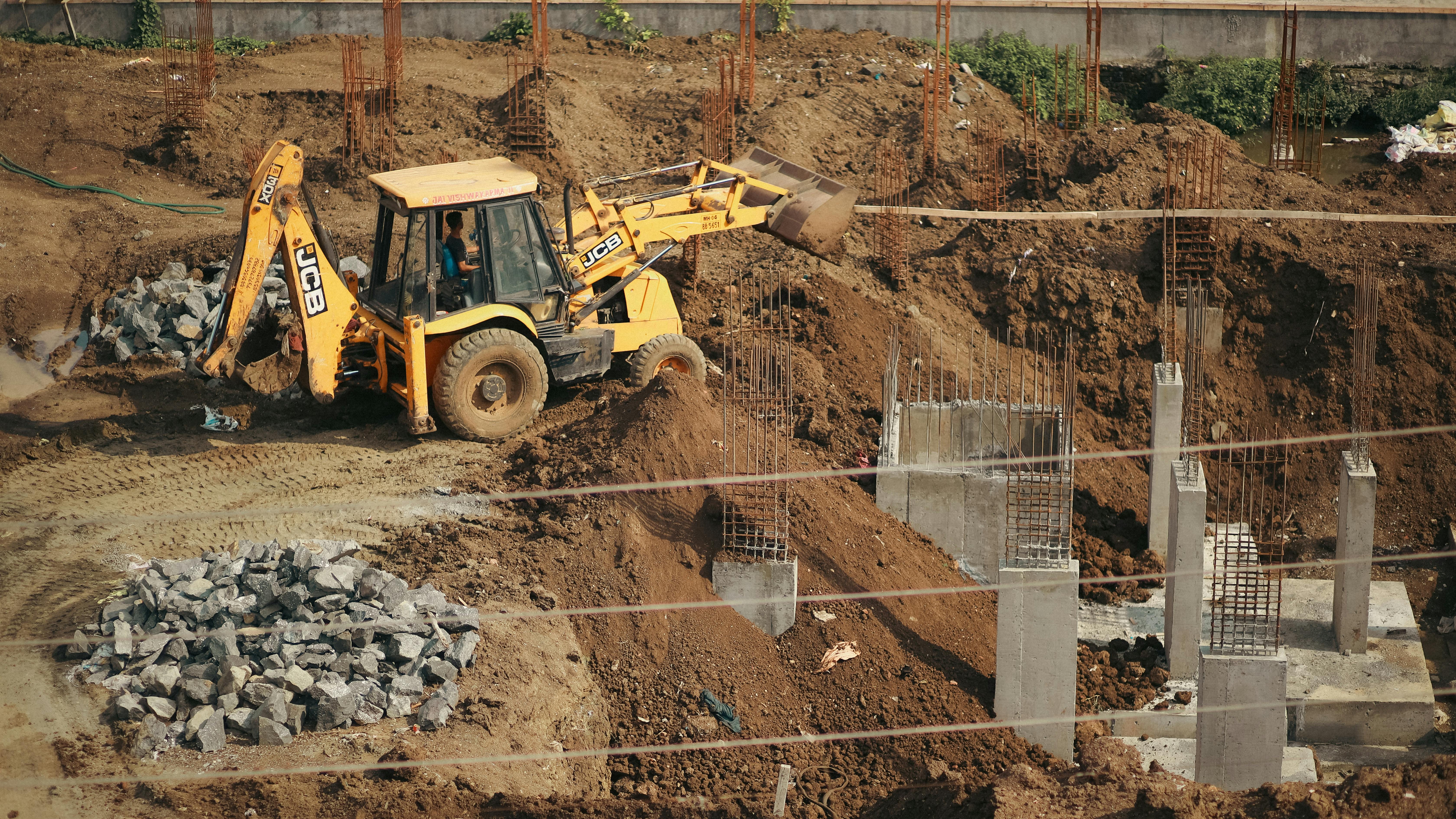 Hamerkop construction – modern multi-story building with paved forecourt, Tanzania