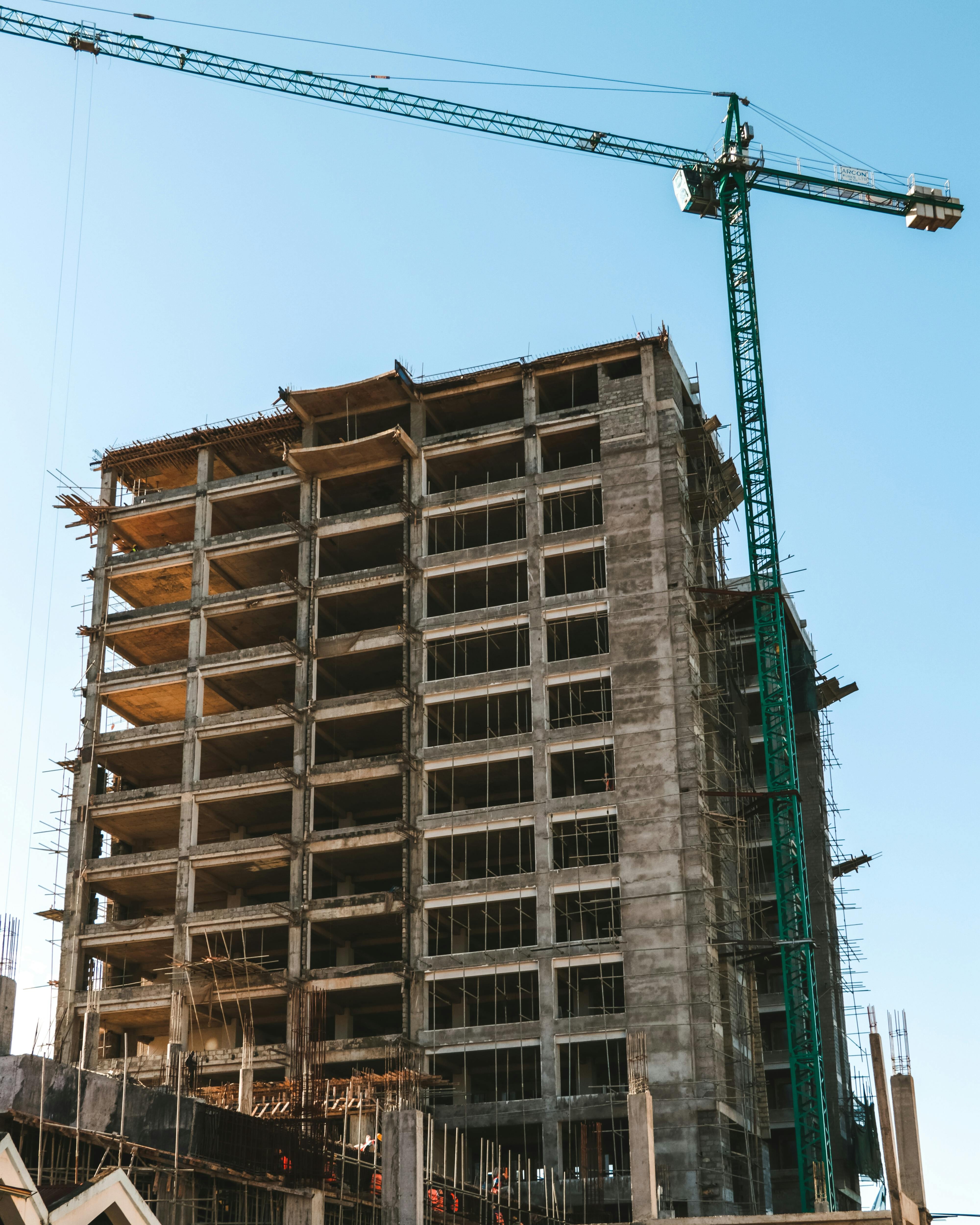 High-rise building under construction with tower crane